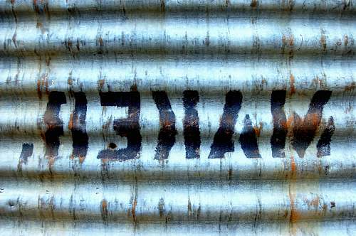 joshua tree national park grey GI sheet with makeh text paint rust